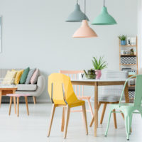 Modern,Colorful,Chairs,At,Dining,Table,Under,Pastel,Lamps,In