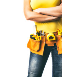 Handywoman,With,Folded,Arms,And,Tool,Belt,Isolated,On,White